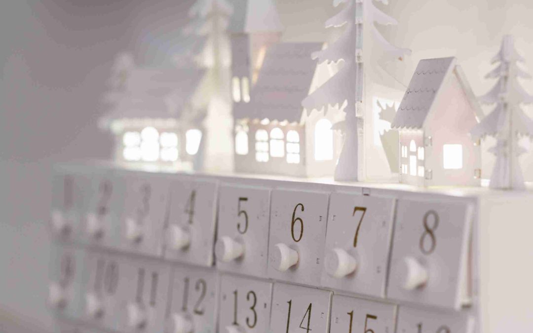 wooden advent calendar with houses on top